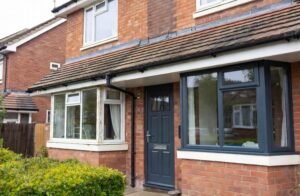 Anthracite grey UPVC windows and front door on a modern UK home showing a professional sprayed finish